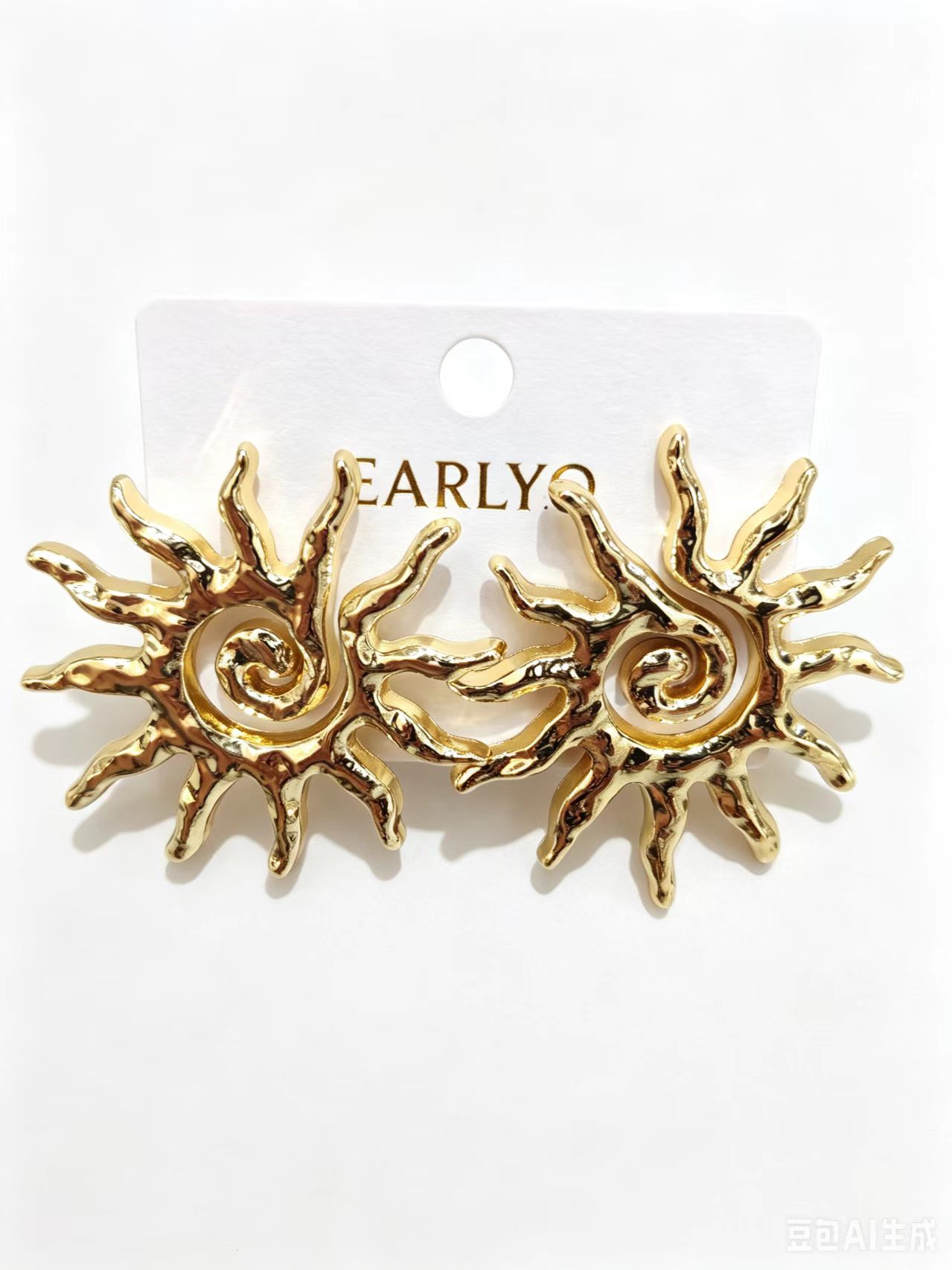Ornate flame swirl pattern gold earrings, artistic statement piece