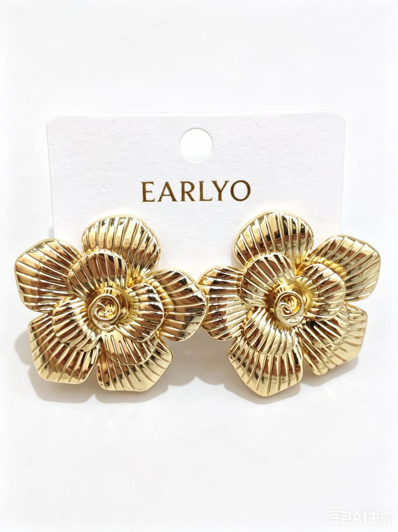 Ribbed petal flower gold earrings with spiral center, textured floral jewelry
