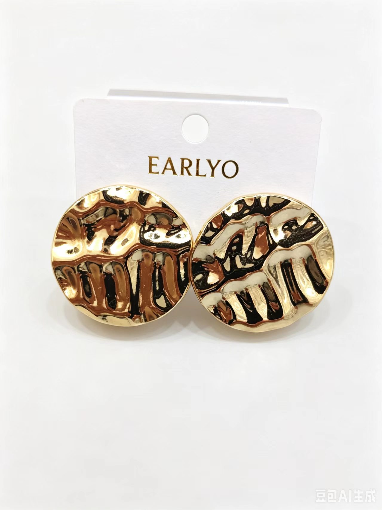 Round disc gold earrings with hammered molten texture, bold stud design
