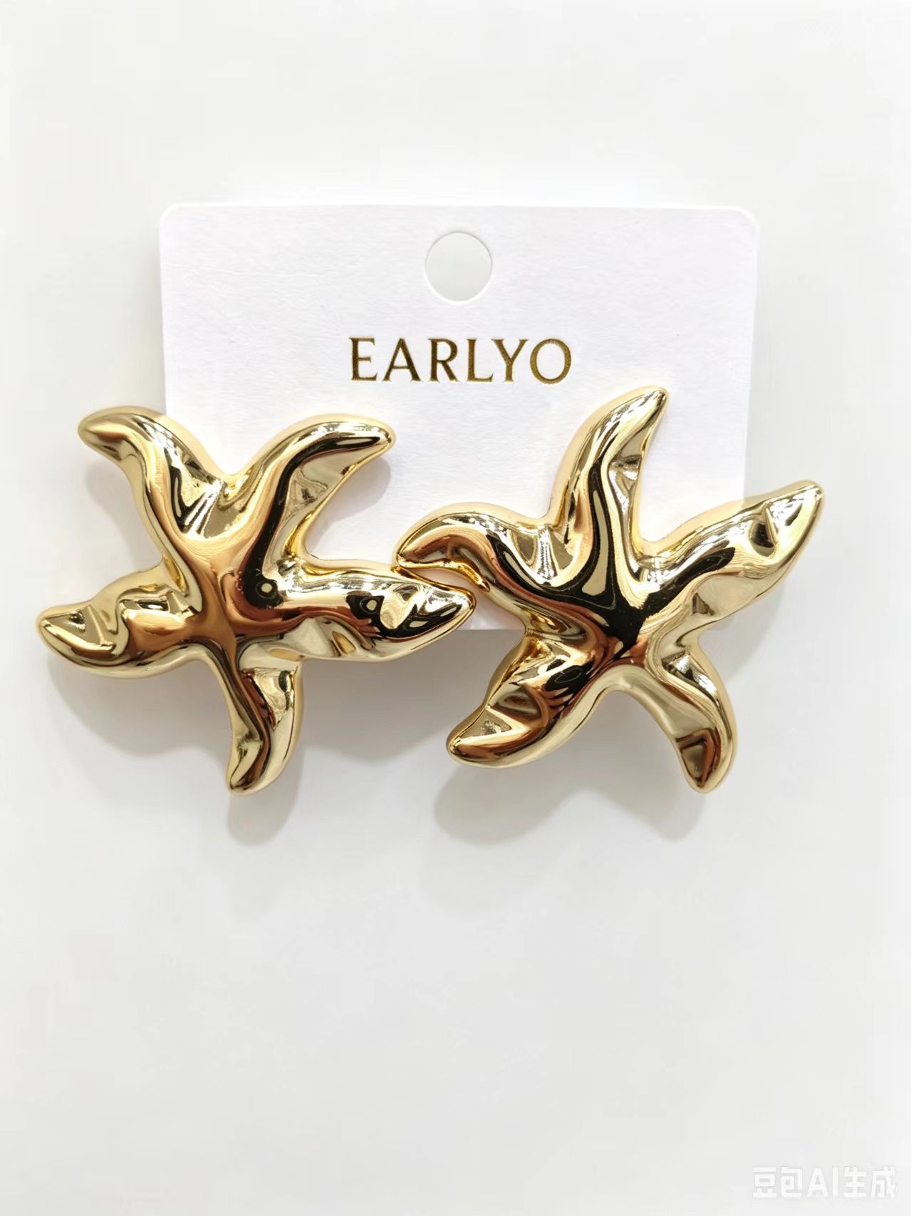 Polished starfish shaped gold earrings, beach nautical style jewelry