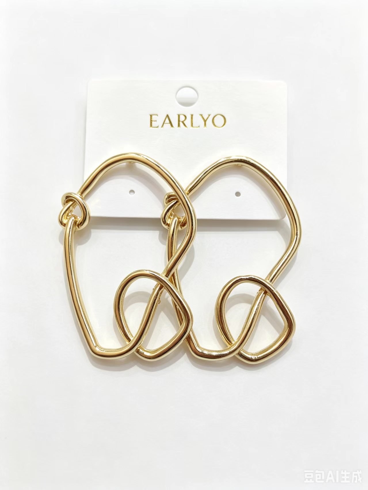 Abstract wire loop gold earrings with knot detail, modern minimalist design